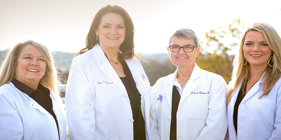 Our providers (L-R:Kelly Alsup, F.N.P.-C, Tasheema L. Fair, M.D.,  Tracie A. Traver, M.D. and Nancy F. Garza, M.D.) have been on both sides of the stethoscope and can understand and empathize with whatever you're facing on your life journey.